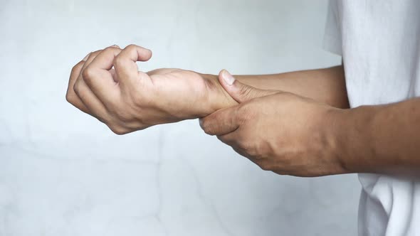 Man Suffering Pain in Hand Close Up
