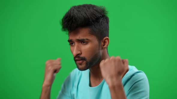 Young Worried Middle Eastern Football Fan Cheering for Team Looking Away Gesturing on Green Screen