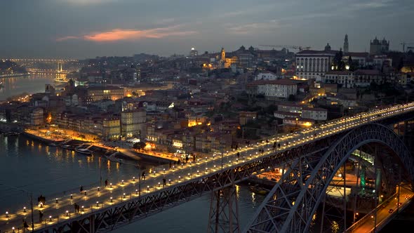 People Walking Across the Dom Luis I Bridge in Porto, Portugal. Panning Evening Shot