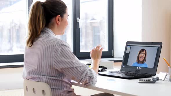 Woman with Laptop Having Video Call at Office