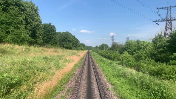 Blured Side View of Highspeed Turning End Back of Train on Landscape of Beautiful Nature Wild Field