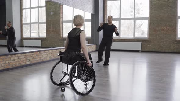 Spectacular Dancing Couple Training in Ballroom