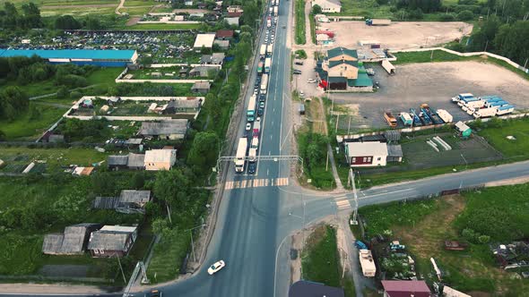 Trucks and Cars Stand at the Crossroads Then Drive Bird'seye View