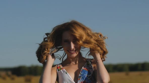 Portrait of a Redhead Woman Enjoying Beautiful Nature in the Countryside