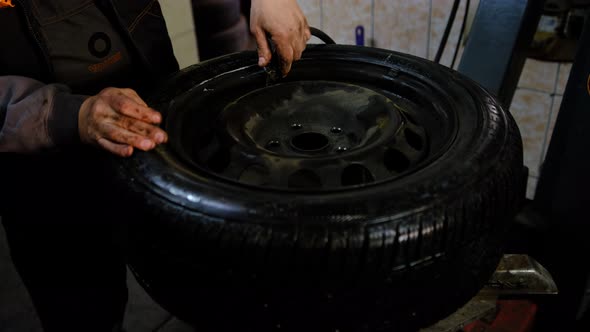 Repair service for wheel tire of car. Pump it after finish with repair