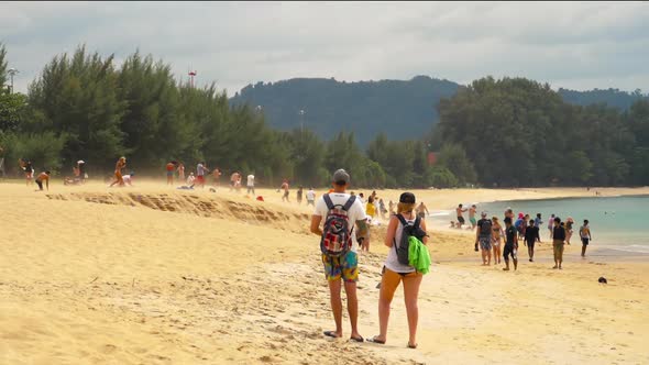 Onlookers on the Beach Watching Aircrafts Departing at Phuket Airport.