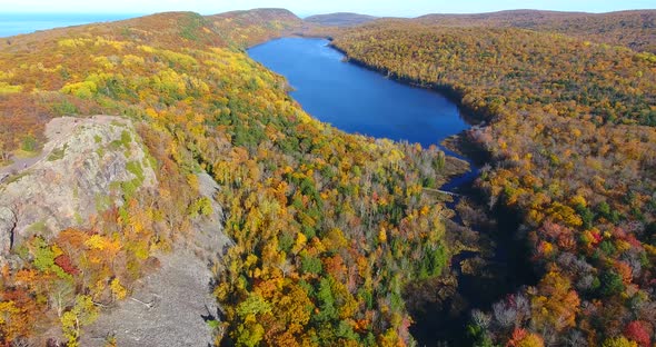 Aerial Over Lake in the Clouds During Peak Fall