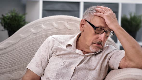 Upset Senior Man 70s Worried About Health Problem Grieving