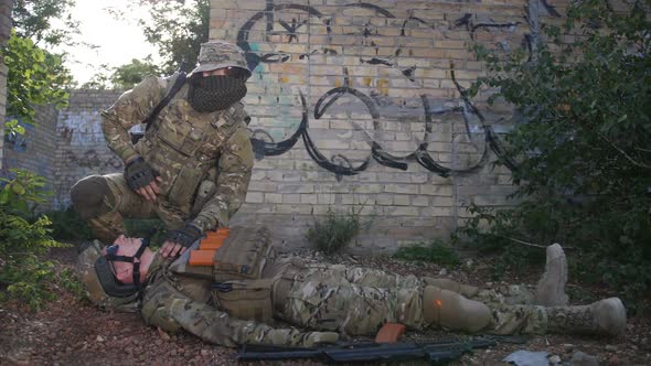 Battlefield Medic Saving Life of Injured Infantryman alt