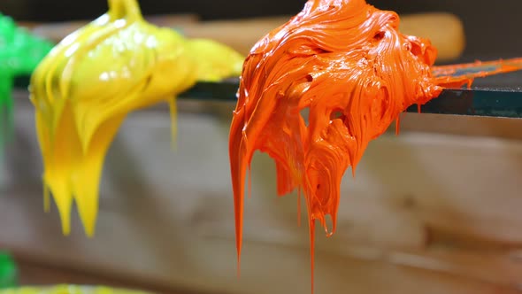 Close Up Orange And Yellow Colors On Trowel