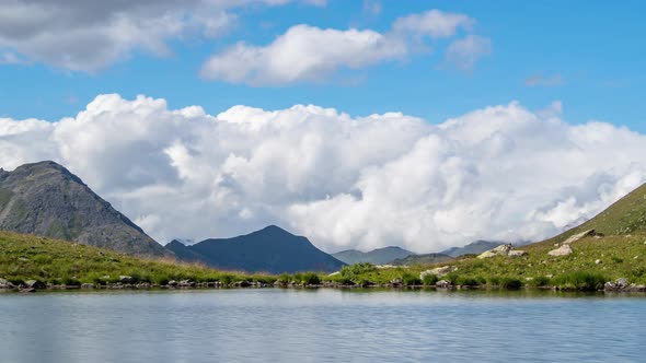 Mountain lake view and cloud reflections