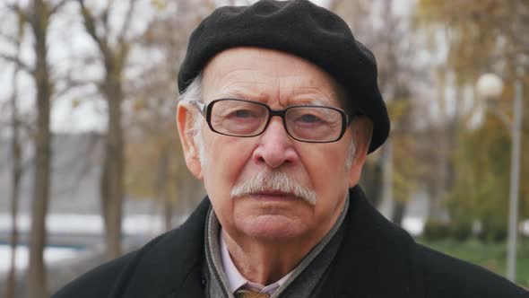 Portrait of senior male looking straight to camera