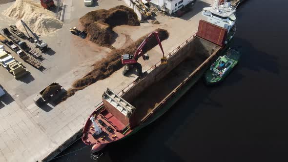 Cargo ship loading sand