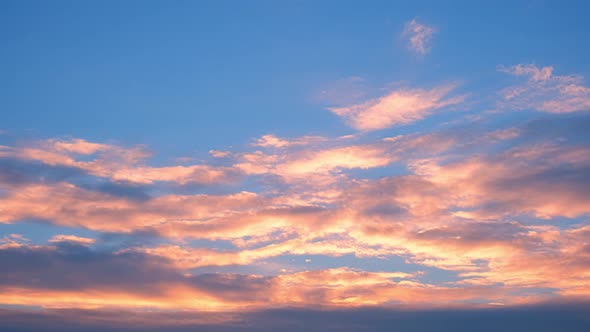 4K UHD : Time lapse of colorful sky during beautiful sunset. Romantic clouds.