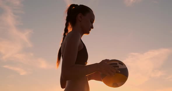 Beach Volleyball Serve - Woman Serving in Beach Volley Ball Game. Overhand Spike Serve. Young People