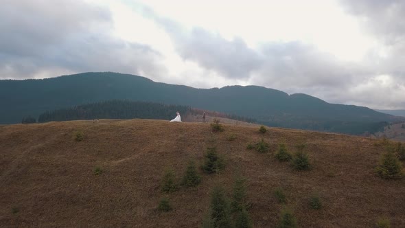 Lovely Young Newlyweds Bride Groom Embracing on Mountain Slope Happy Wedding Couple Family in Love