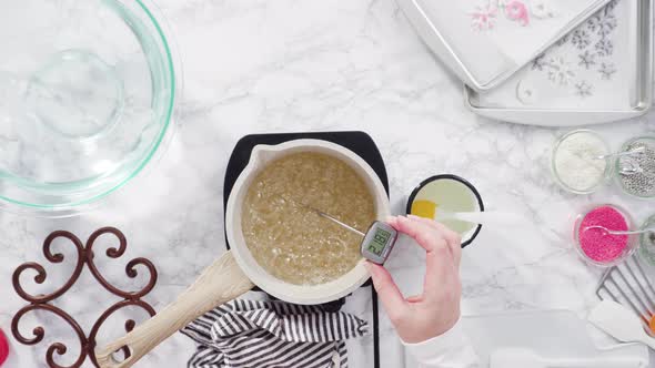 Flat lay. Step by step. Caramelizing sugar in a small cooking pot over the small electric stove