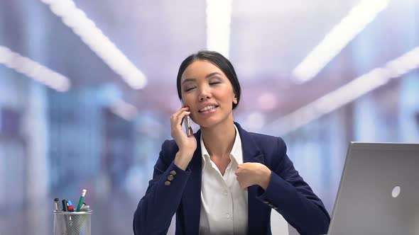 Smiling Attractive Businesslady Chatting on Phone During Break, Relaxation