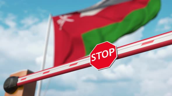 Opening Boom Barrier with Stop Sign at Flag of Oman alt