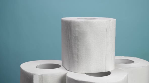 A Lot of Toilet Paper Closeup on Blue Background