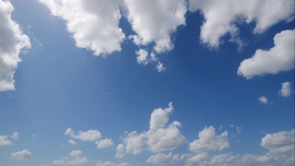 Time lapse of white cloud moving pass around sky background