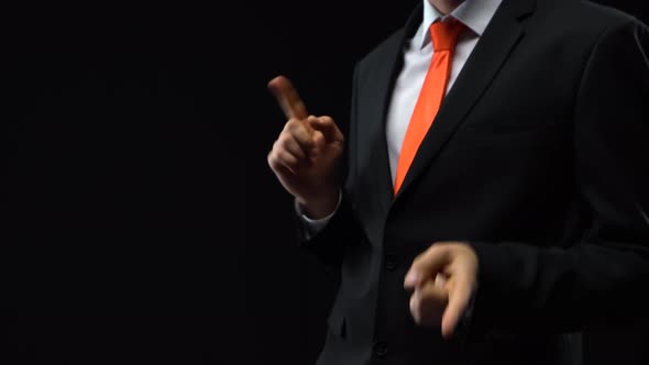 Businessman in a Black Suit Dancing Making Movements with His Fingers. Mockup Ready for Your Text or