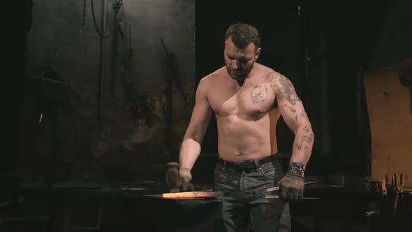 Blacksmith Working with a Serious Face