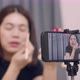 Asian woman beauty blogger influencer makeup artist recording on smartphone. - VideoHive Item for Sale