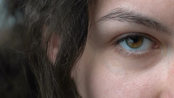 Woman With Tired Red Eyes Looking Into Camera