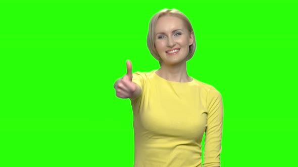 Portrait of Adorable Caucasian Woman Shows Thumb Up