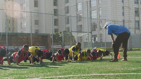 Soccer kids exercising in a sunny day