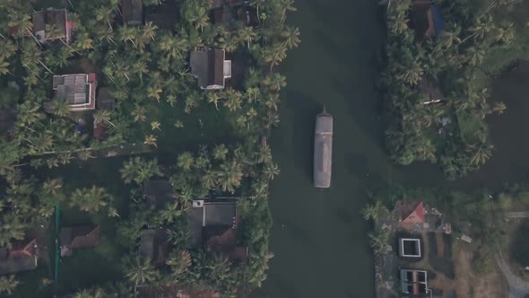 Boat trip around Kerala backwaters at Alleppey, India. Aerial top down drone view