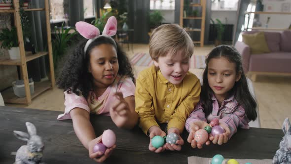 Children Looking at Easter Eggs