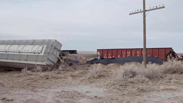 Panning over wreckage from train derailing the tracks