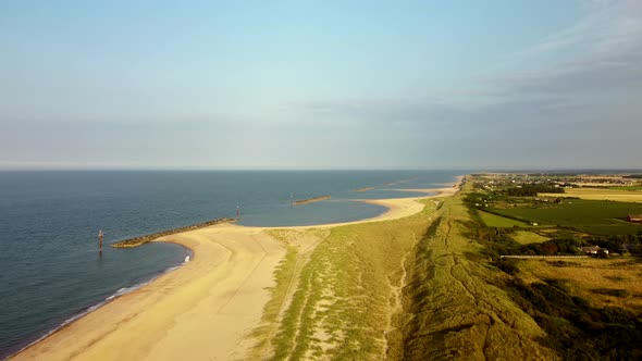 4K Aerial Drone Above Scenic Coastal Beach Landscape. Norfolk, England.