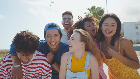 Group of friends having fun on the beach.