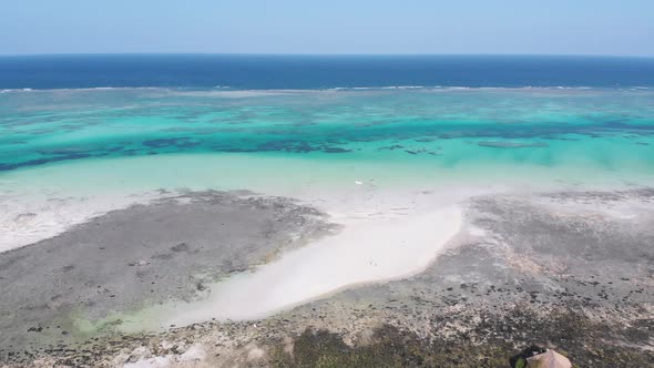 Paradise Tropical Shore and Barrier Reef in Ocean Sandbanks Zanzibar Aerial View