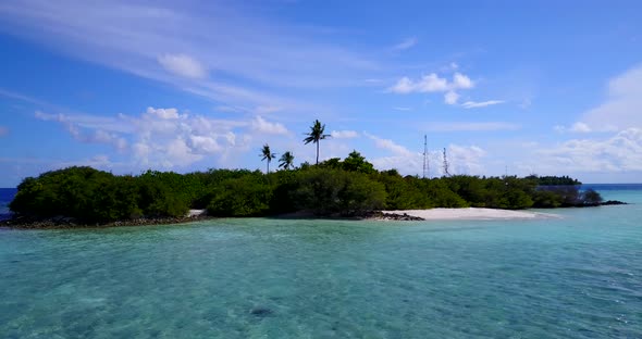 Tropical drone island view of a white paradise beach and aqua blue water background in colourful 4K