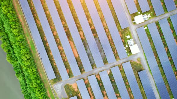 Drone fly over solar farm, renewable energy from solar.