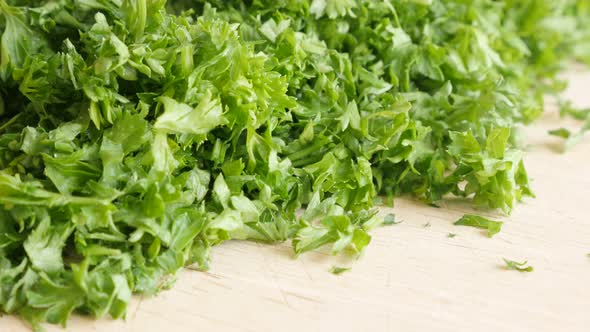 Green vegetable parsley plant cuts on  cutting board  4K 3840X2160 UltraHD  footage - Organic Petros