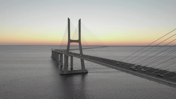 Amazing view of Vasco da Gama Bridge at sunset, Lisbon in Portugal. Aerial static