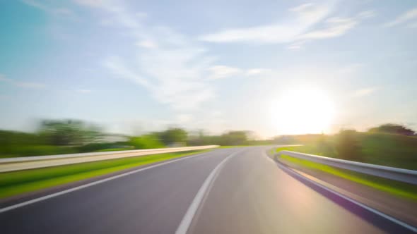 On a rural road at sunset