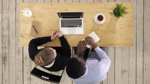 Business Long Distance Video Call, Businessman and Businesswoman Talking To Someone and Taking Notes