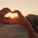 A Woman Tourist Folded Her Hands Heart Shape at Sunset - VideoHive Item for Sale