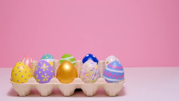Colorful Painted Easter Eggs in a Cardboard Box