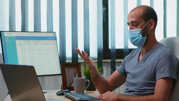 Man with Mask During Video Meeting