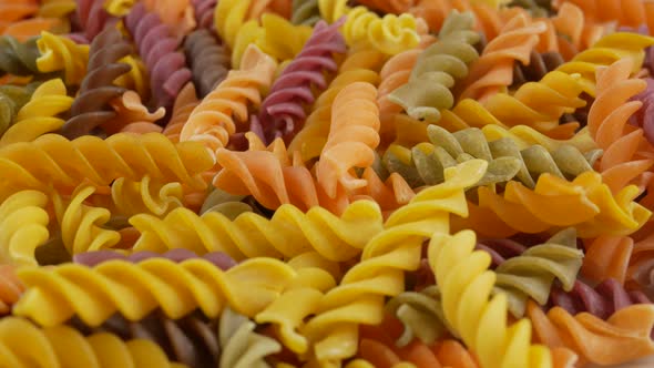 Colored italian fusilli raw pasta