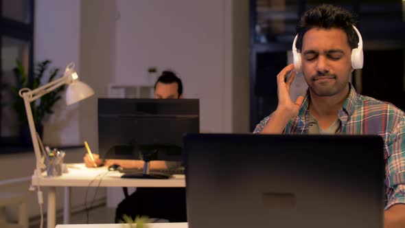 Man in Headphones Working with Computers at Office 66