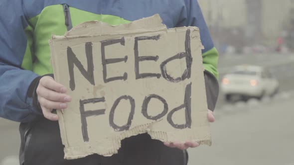 The Inscription "Need Food" By a Poor Homeless Tramp. Kyiv. Ukraine