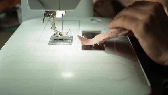 Close Up of Women Using Sewing Machine